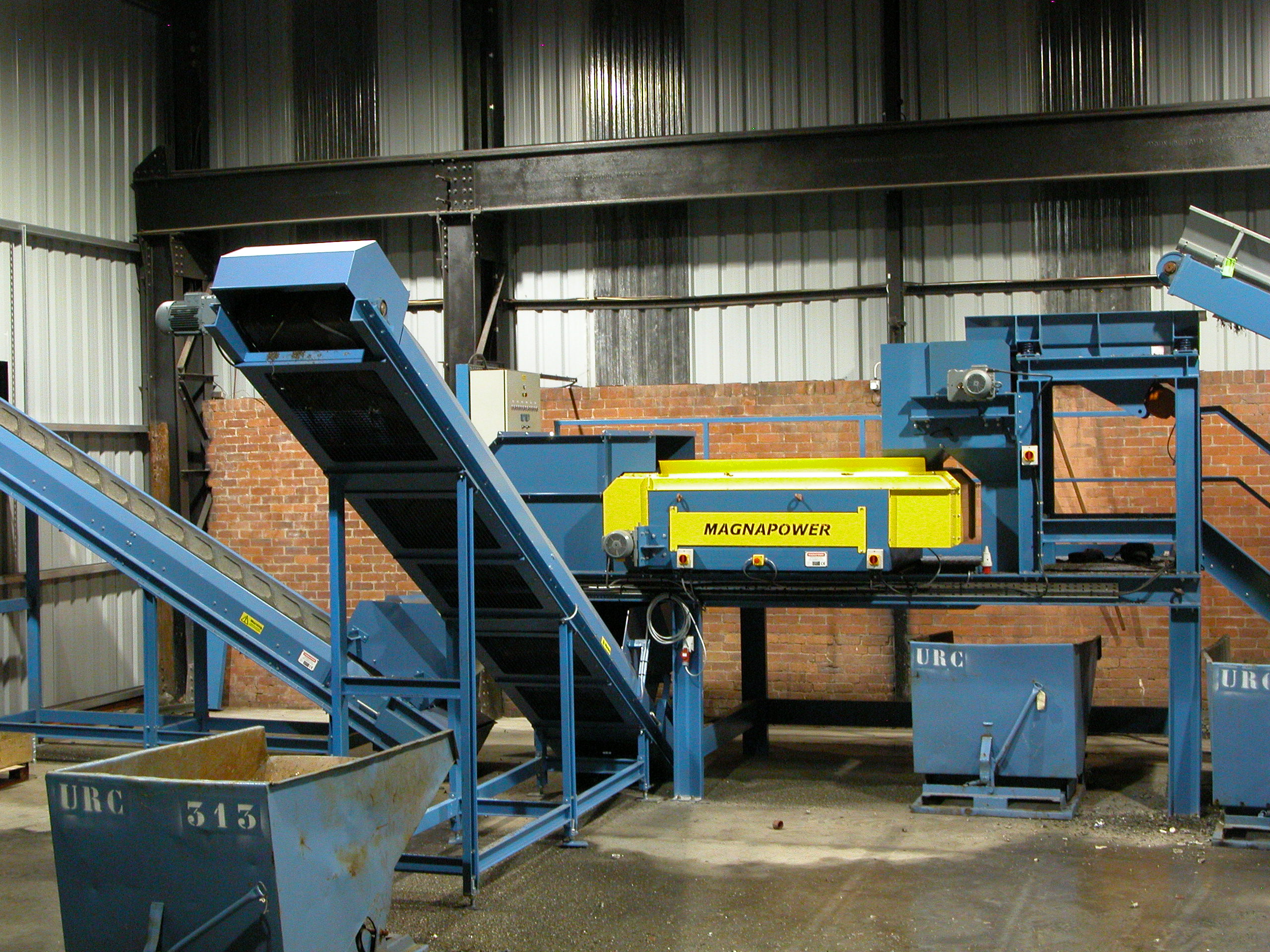 Drum magnet and eddy current separating metals from shredded electrical waste