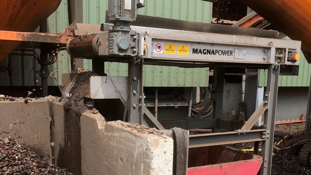 Magnetic pulley separating ferrous metal from recycled aggregate