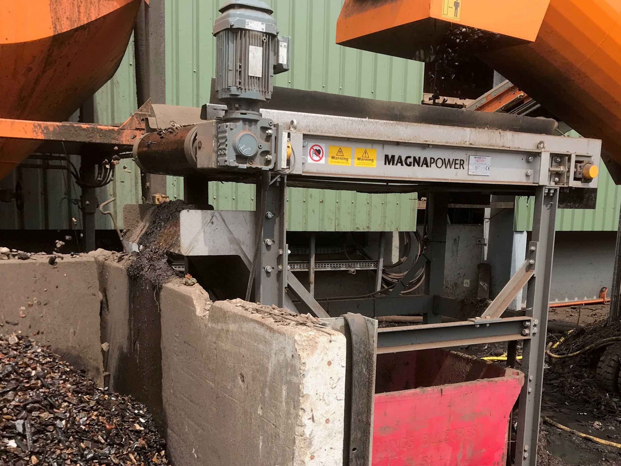 Magnetic pulley separating ferrous metal from recycled aggregate