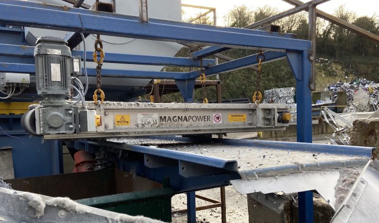 Overband magnetic separator removing ferrous metals from waste stream in a recycling and magnetic separation system. data-large-image=