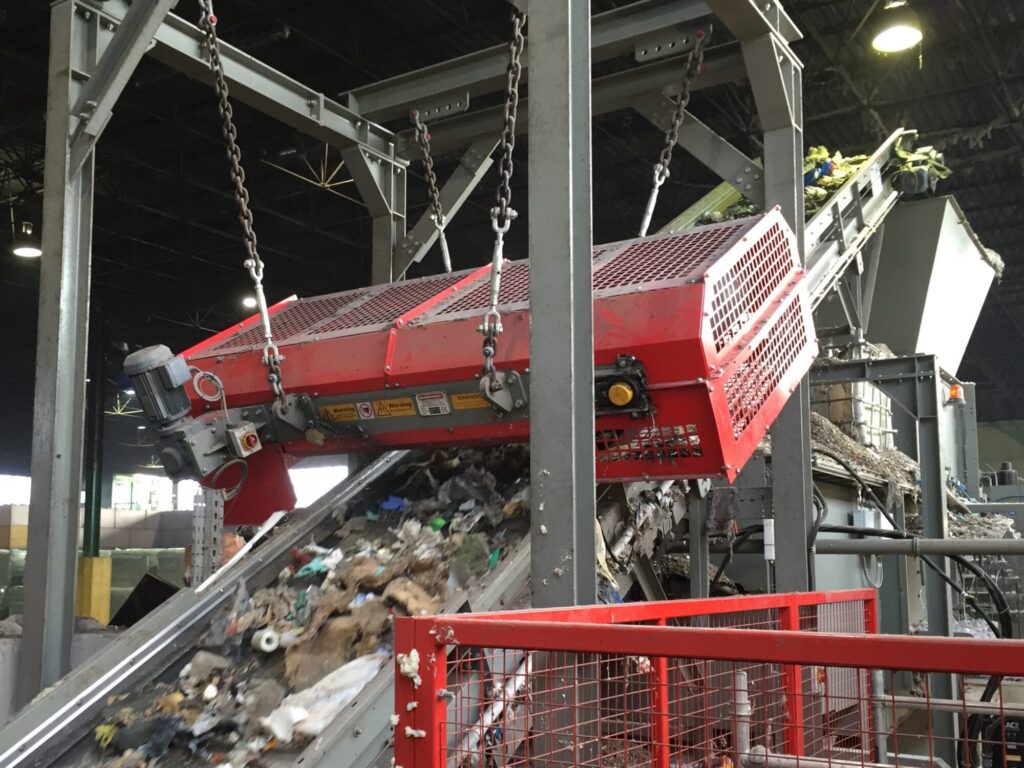 Overband magnetic separator removing ferrous metals from waste stream in a recycling and magnetic separation system. data-large-image=