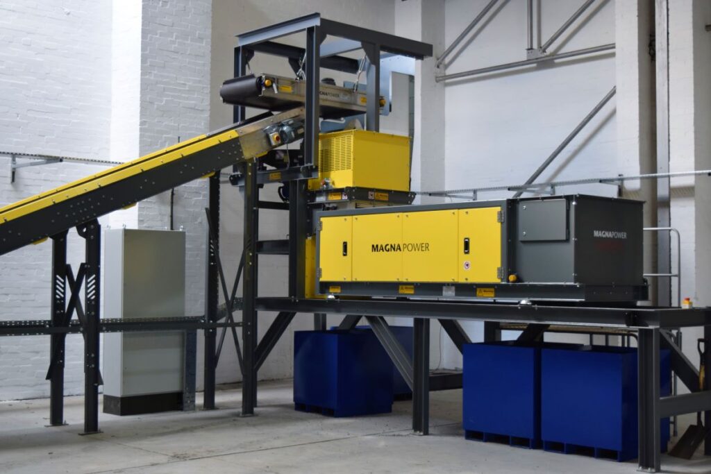 Eddy current separator extracting non-ferrous metals from eddy current waste stream with advanced magnetic separator setup for recycling and material recovery. data-large-image=