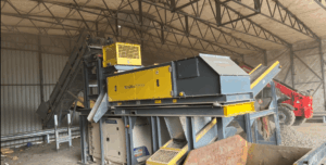 Eddy current separator extracting non-ferrous metals from eddy current waste stream with advanced magnetic separator setup for recycling and material recovery.