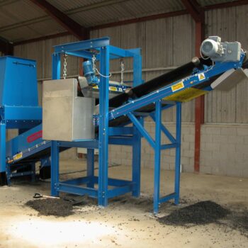 Image of a tyre shredding plant conveyor system with magnetic steel separation using a crossbelt overband magnet and a magnetic head pulley.