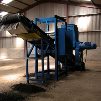 Image of a tyre shredding plant conveyor system with magnetic steel separation using a crossbelt overband magnet and a magnetic head pulley.