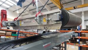 Custom overband crossbelt magnetic separator above conveyor belt removing ferrous materials