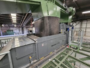 Eddy current separator extracting non-ferrous metals from eddy current waste stream with advanced magnetic separator setup for recycling and material recovery.