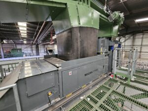 Eddy current separator extracting non-ferrous metals from eddy current waste stream with advanced magnetic separator setup for recycling and material recovery.