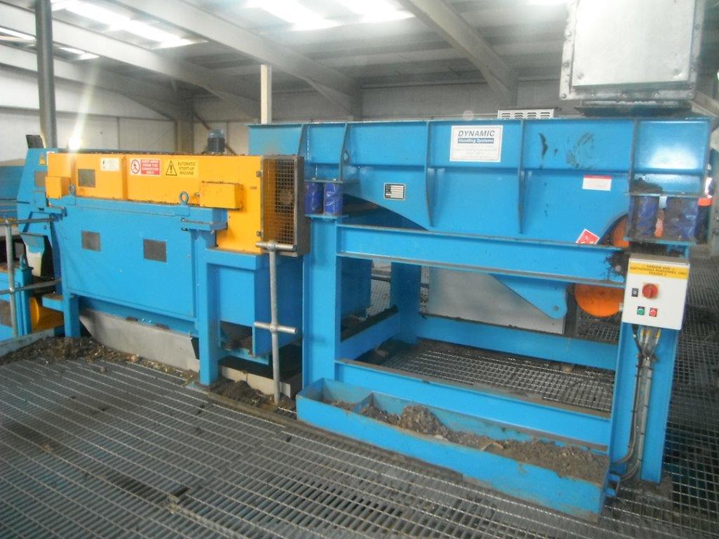 A vibratory feeder feeding a Eddy Current Separator in the recycling industry. Controlled vibrations move bulk materials continuously. Flow rates can be adjusted for different applications. data-large-image=