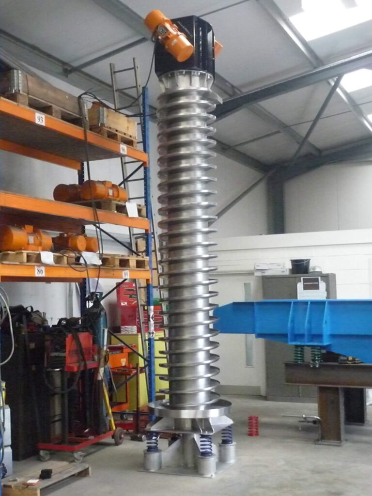 A 4 metre high spiral-shaped material handling machine that uses controlled vibrations to lift bulk materials vertically, offering a space‑saving alternative to traditional conveyor systems.