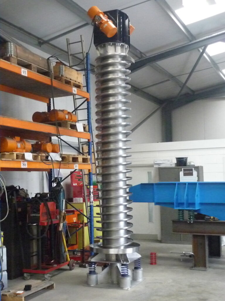 A 4 metre high spiral-shaped material handling machine that uses controlled vibrations to lift bulk materials vertically, offering a space‑saving alternative to traditional conveyor systems.