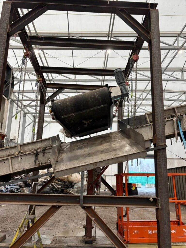 Magnapower overband magnet positioned above a conveyor at AEB, Amsterdam removing metal nitrous oxide canisters from the waste stream. data-large-image=
