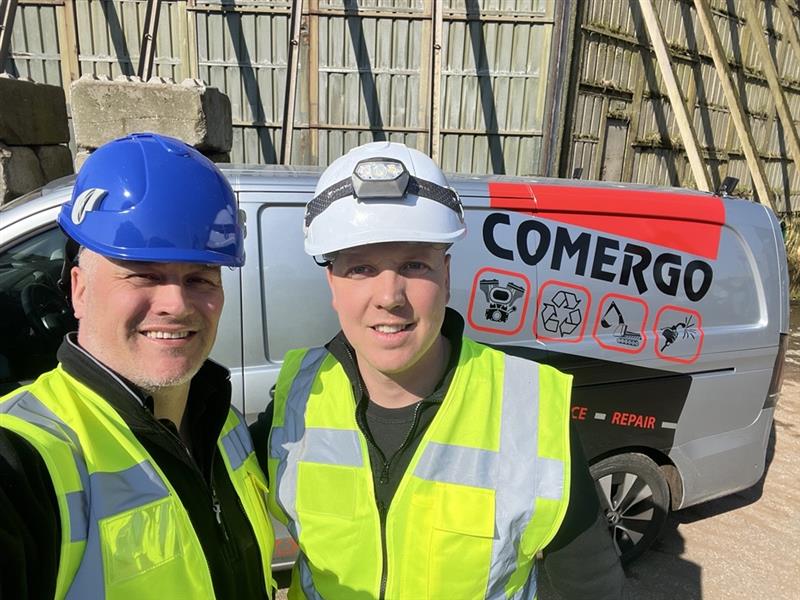 Matt Hencher and Jan Comergo standing together at AEB Amsterdam’s facility after installing Magnapower overband magnets. data-large-image=
